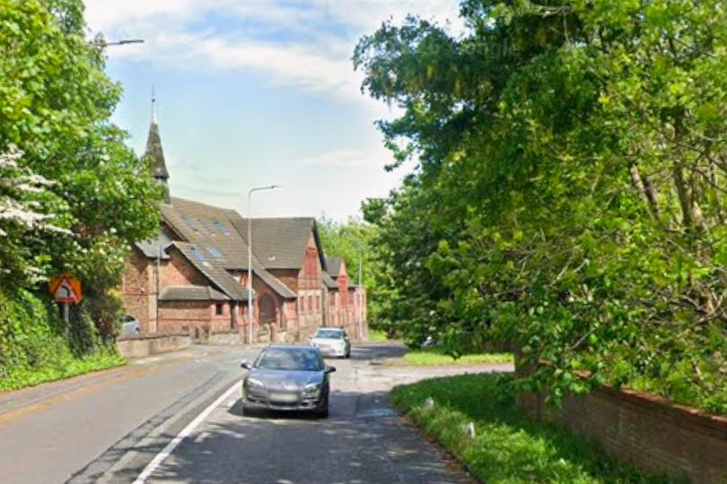 Driver taken to hospital after car crashes into wall on A56